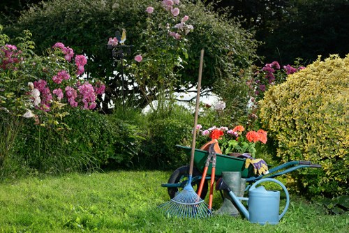 Gardener preparing tools with safety gear in a Haringey garden